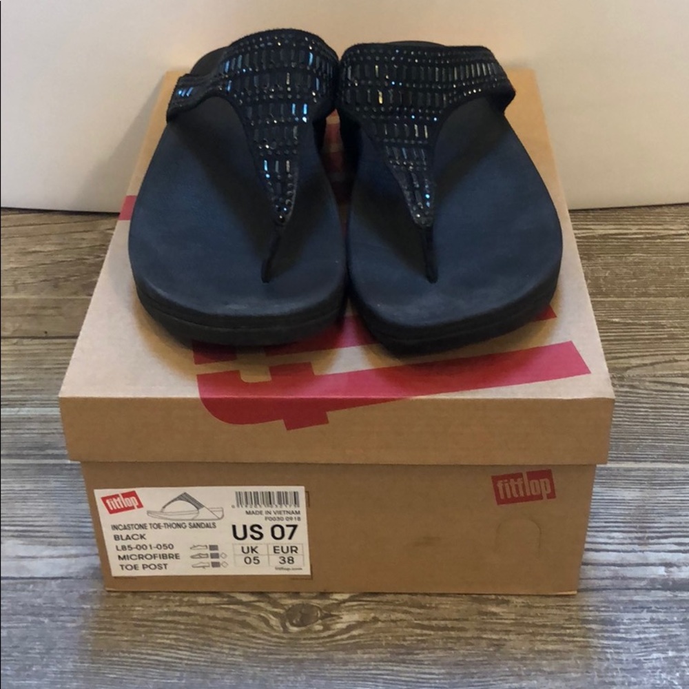 Black wedged Fitflop sandals.